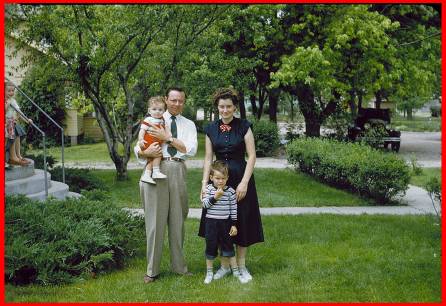 My family, 1953. I am standing in front of my mother. My dad is holding my brother. One of my cousins is on grandpaâ€™s porch at the left. 